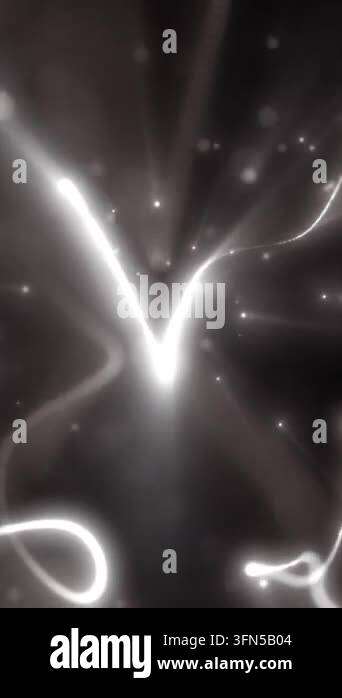 Abstract monochrome light trails flowing through soft glowing particles ...