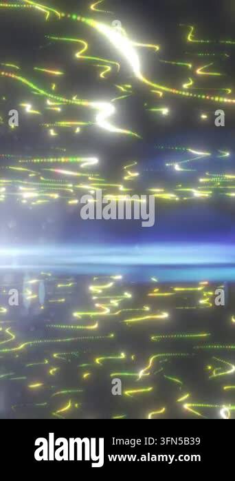 Abstract scene of glowing yellow and green light trails drifting across ...