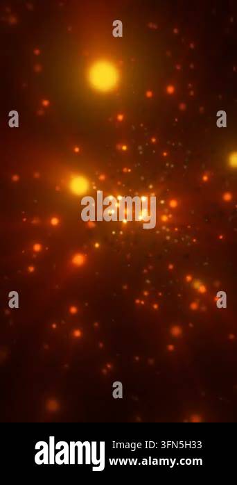 Abstract orange glowing particles and soft bokeh floating across a dark ...