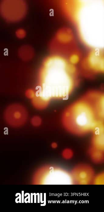 Abstract defocused bokeh lights in glowing red, orange, yellow, and ...