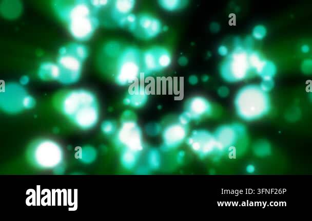 Abstract green blurred holiday background with magical bokeh of glowing ...
