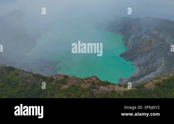Volcanic Crater Lake with Turquoise Acidic Water and Mist Stock Video ...