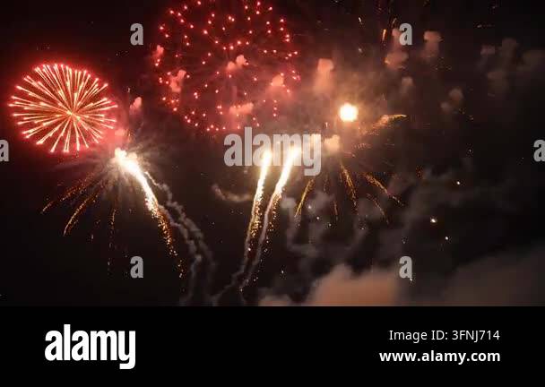 Colorful fireworks exploding in night sky Stock Video Footage - Alamy