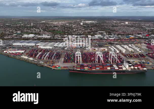 Aerial view of a large container ship docked at a commercial shipping ...