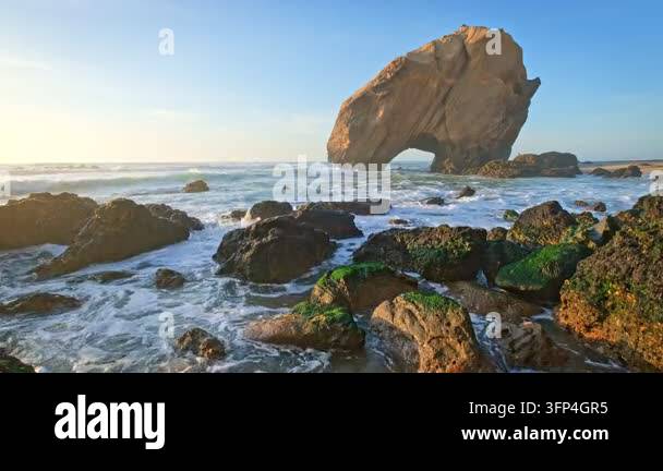 Large Rocks Uk Penedo do Guincho is a large rock arch at Praia da Santa Cruz in ...
