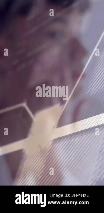 Vertical video: Man touching face as camera panning, code-overlay over ...