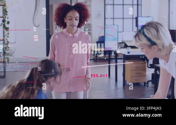 Woman presenter walking up to table and presenting tablet for design ...