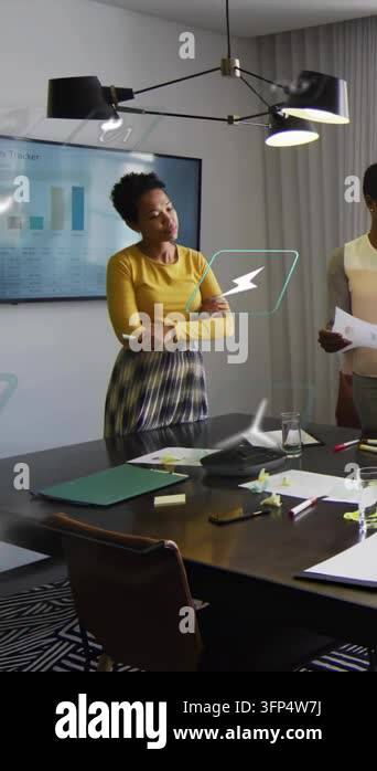 Vertical video: Host gesturing causing icons over table showing ...