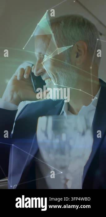 Vertical video: Senior man taking biz call holding phone smiling in ...