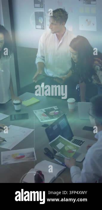 Vertical video: Man tapping tablet, gesturing and activating chart ...