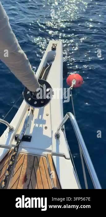 Bow Rope Vector Sailing yacht moored to buoy with rope in blue sea. Close view of bow ...