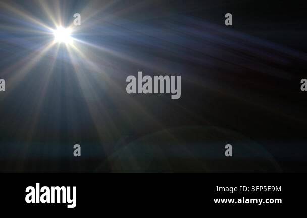Bright sunlight rays creating a lens flare effect in the dark night sky ...