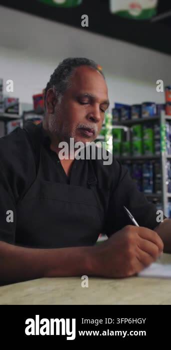Notepad Clip Vector Vertical video showing a man wearing a black apron is writing on a ...