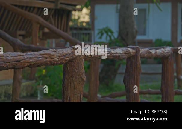 Rustic Cedar Rails Close-up of a rustic wooden railing with a blurred background of a ...