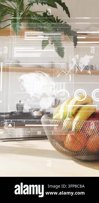 Graphs and world map animation over modern kitchen with fruit bowl and ...