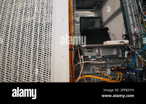 Close-up view of a server rack with blinking lights and connected ...