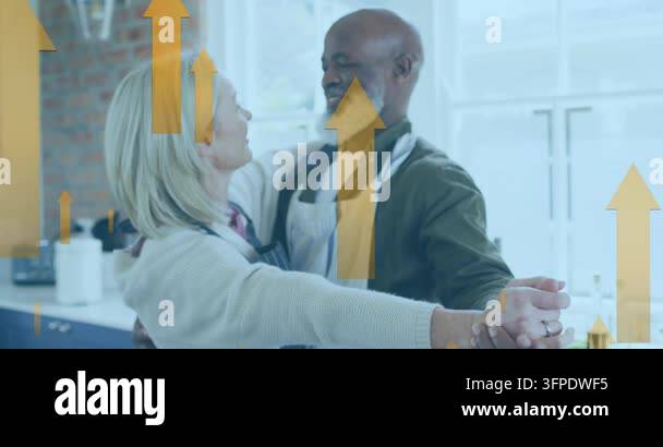 Animation of multiple up arrow over diverse couple dancing wearing ...