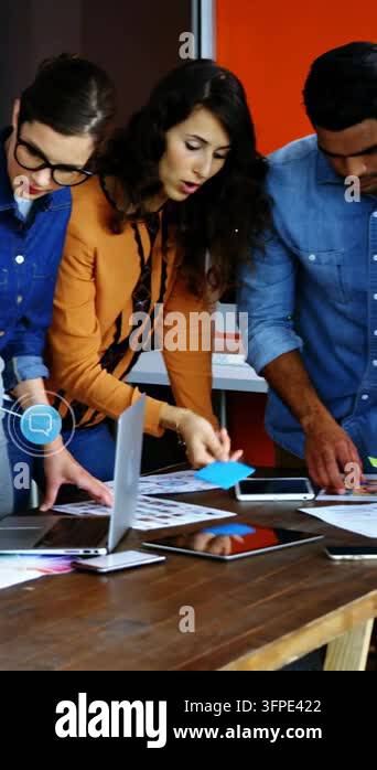 Workspace Call Vertical video: Marketing team organizing layouts for ad taking call ...