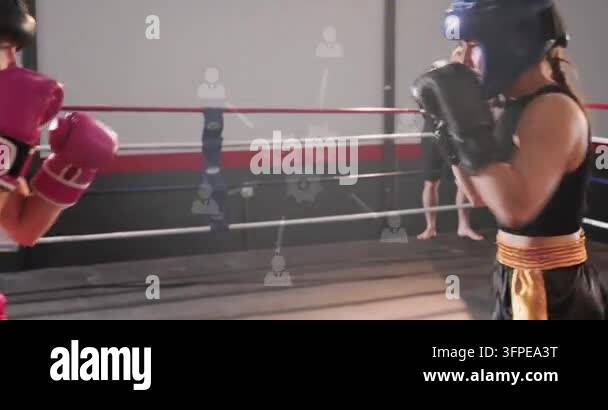 Prrying Black-clad boxer parrying pink jab walking to corner to train as coach ...