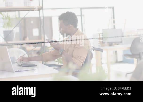 Male business pro reaching for trackpad while holding phone, using ...