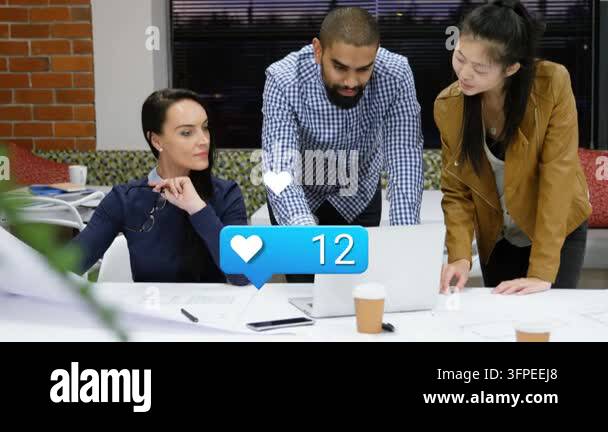 Team reviewing designs, scrolling laptop and causing hearts rising ...