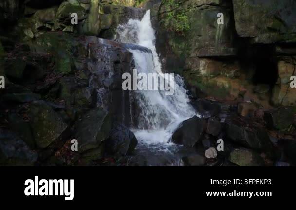 Image For Rocks Multi-Tiered Waterfall Cascading Over Dark Rocks in Forest Stock Video ...