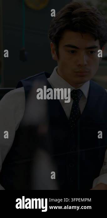 Vertical video: Businessman watching data graph emerging across glass ...