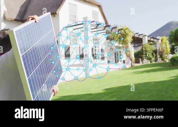 Solar man carrying panel by lawn activating blue network over windows ...