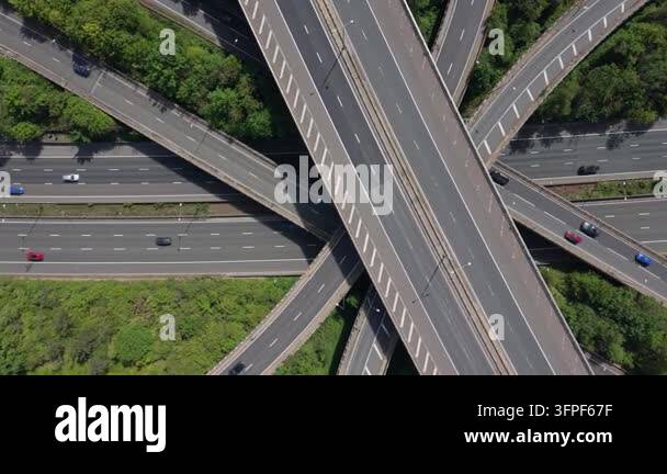 An aerial perspective shows a vast highway interchange bustling with ...