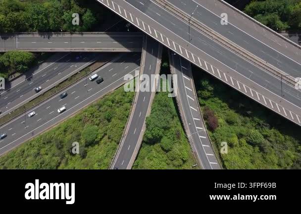 Extensive Ramp Daytime view from above captures cars moving across a bustling ...