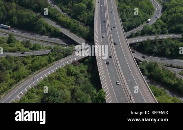 An aerial perspective showcases a bustling multi-level highway ...