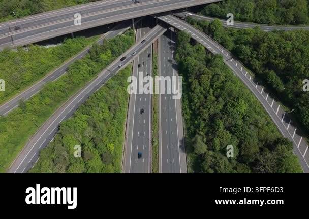 An aerial view shows a busy highway interchange with cars and trucks ...