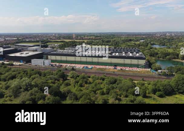 Aerial perspective of a large modern data center facility. The ...