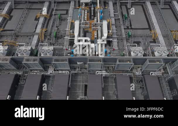 Aerial perspective shows a vast Data Center with many cooling units and ...