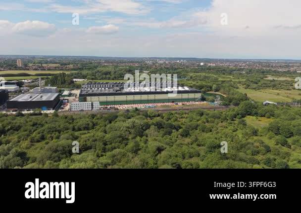 View of a large Data Centre complex situated among green trees and ...
