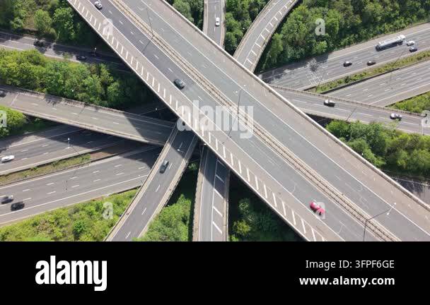 Vehicles move along multiple elevated roads and ramps at a large ...