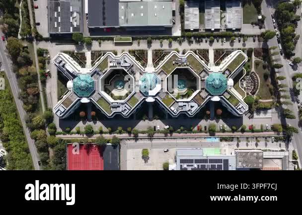 Aerial drone view of a modern X-shaped office complex in Munich ...