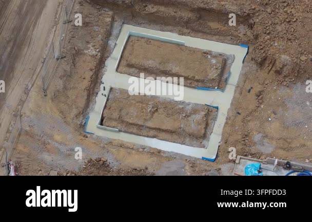 Daytime aerial look at a construction site where a new building ...