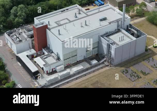 Loading Vehicle Vector Aerial view of a large white technology research center building in a ...