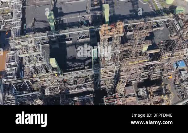 Drone perspective captures a large industrial facility featuring ...