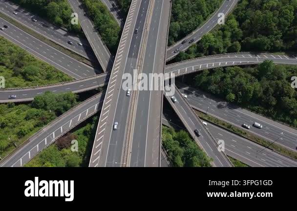An aerial perspective of a massive highway interchange with many levels ...
