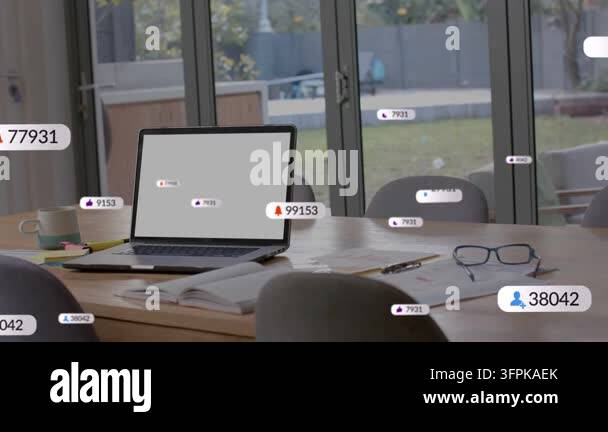 Laptop receiving alert, spawning floating notification badges and ...
