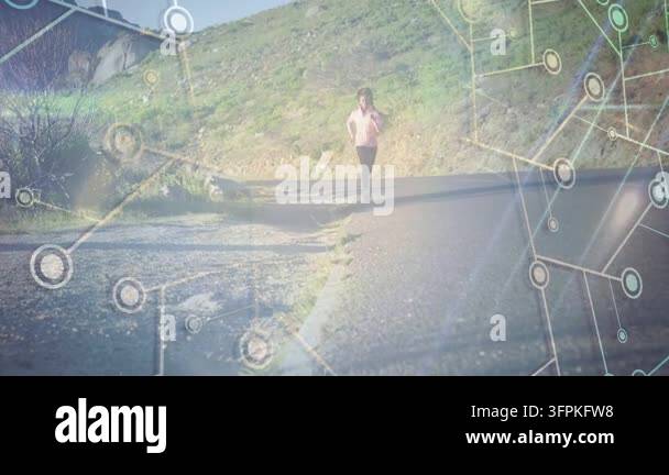 Female runner walking then jogging toward camera on hill road, with ...