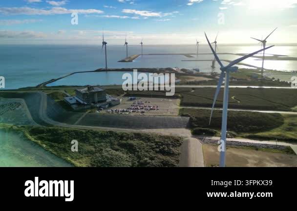 Wind turbines generating energy near coastline Stock Video Footage - Alamy