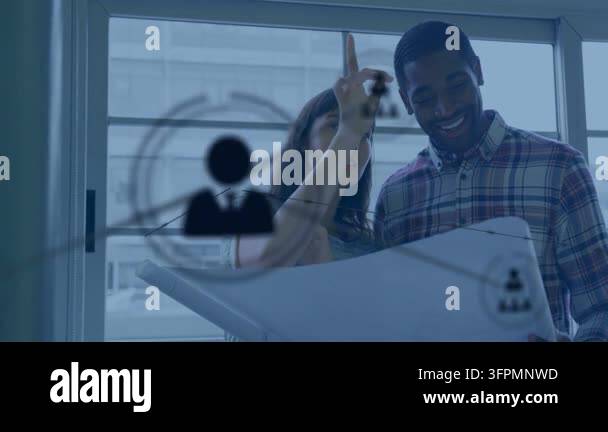 Woman pointing plans man holding plans by window generating animated ...