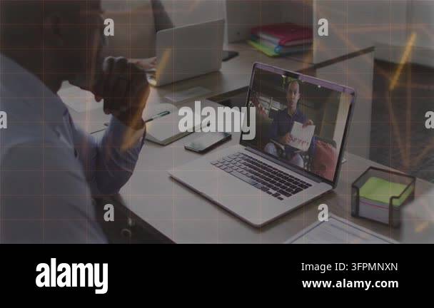 Man leaning watching laptop as presenter showing paper, glowing UI ...