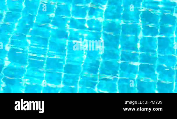 clear blue swimming pool water with shimmering reflections and tiled ...