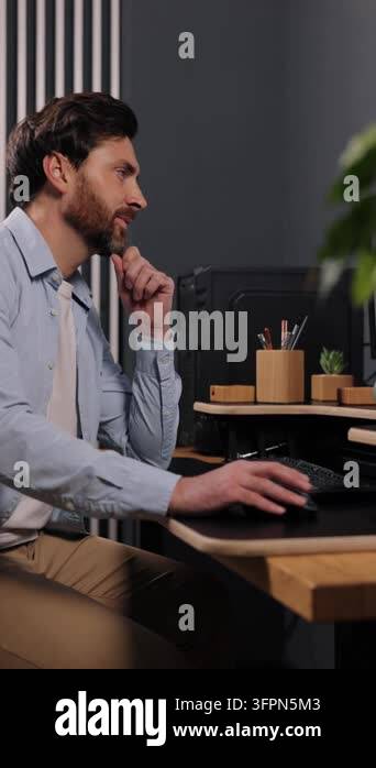 desktop computer, contemporary office, remote setup. Viewed from side ...