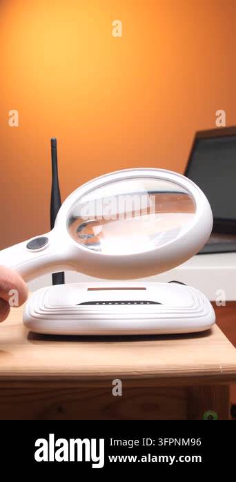 Vertical video person holding a magnifying glass over a white wireless ...