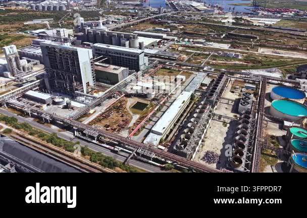 Large Area Aerial view shows a large industrial site with power plants and various ...